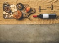 Wine bottle, vintage corkscrews and appetizers board, copy space