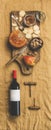 Wine bottle, vintage corkscrews and appetizers board, vertical composition Royalty Free Stock Photo