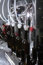 Wine is bottled. New wine. Small wine production. Craft winery. Wine of new harvest. Vertical photo..