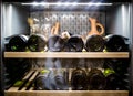 Wine bottles cooling in refrigerator Royalty Free Stock Photo