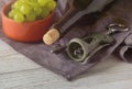 Wine bottles, glass, corkscrew, grapes on table. top view. Royalty Free Stock Photo
