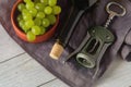 Wine bottles, glass, corkscrew, grapes on table. top view. Royalty Free Stock Photo