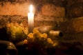 Wine bottles and grapes with candle Royalty Free Stock Photo