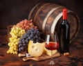 Wine bottles, grapes, cheese, glass of red wine and old barrel Royalty Free Stock Photo