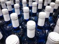 Wine bottles - many blue bottles with white label / bottlenecks Royalty Free Stock Photo