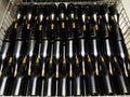 Wine bottles on metal box in factory Royalty Free Stock Photo