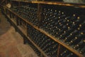 Wine bottles in a old warehouse. Wine storage Royalty Free Stock Photo