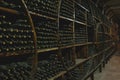 Wine bottles in a old warehouse. Wine storage Royalty Free Stock Photo
