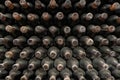 Wine bottles pattern stacked in winery Royalty Free Stock Photo
