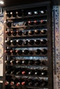 Wine bottles stacked in cellar room