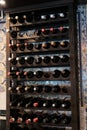 Wine bottles stacked in cellar room