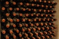 bottles stacked up in old wine cellar Royalty Free Stock Photo