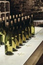 Wine bottles stand in a row on the table Royalty Free Stock Photo