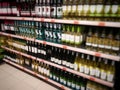 wine bottles on supermarket shelves Royalty Free Stock Photo