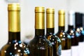 Wine bottles. Trade in alcoholic beverages in the store. Close-up Royalty Free Stock Photo