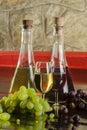 Wine bottles, wine glasses and grapes