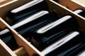 Wine bottles in wooden crate on wood table background, close-up. Royalty Free Stock Photo
