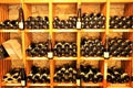 Wine bottles on wooden shelves