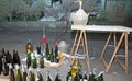 Wine bottling in the backyard with the Carboy and glass bottles Royalty Free Stock Photo
