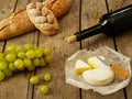 Wine, bread, cheese and grapes Royalty Free Stock Photo