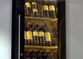 Wine cabinet with humorous statement inside historic Pest-Buda Bistro, Hungary