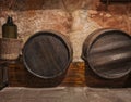 Wine cask barrels and bottle stacked in the old cellar Royalty Free Stock Photo