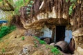 A wine cellar in abandoned old house in a thicket of trees and shrubs, outbuildings, old cask, a village without people