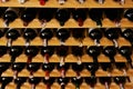 Wine cellar, bottle and storage on rack in vineyard for restaurant stock, winery and shelf with alcohol display Royalty Free Stock Photo