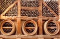 Wine cellar with bottles in wooden shelves of rural storage or restaurant underground Royalty Free Stock Photo