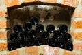 Wine bottles in the brick shelf