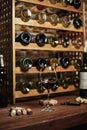Wine cellar with bottles on wooden shelves Royalty Free Stock Photo