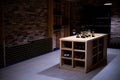 Wine cellar with bottles on wooden shelves Royalty Free Stock Photo