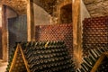 Wine cellar, a row of champagne bottles Royalty Free Stock Photo