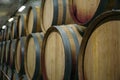Wine cellar with rows of old wooden wine barrels, perspective, copy space Royalty Free Stock Photo