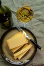 Wine and cheese pairing, local Comte cheese produced in the Franche-Comte region and special and characteristic yellow wine vin