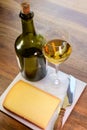 Wine and cheese pairing, local Comte cheese produced in the Franche-Comte region and special and characteristic yellow wine vin