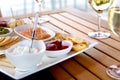 Wine and Cheese on Patio Table Royalty Free Stock Photo