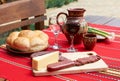 Wine, cheese and saussage on table