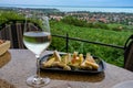 Wine, cheese table over the Lake Balaton on the hill Dinner, lunch, romantic date, picnic, eating on nature. Csopak wine Royalty Free Stock Photo