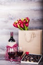 Wine , chocolates and tulips