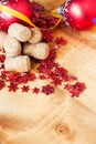 Wine cork with a blurred Christmas tree ball and decor snowflakes on wooden background. Selective focus and copyspace . Royalty Free Stock Photo