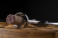 Wine cork in corkscrew on wooden table
