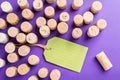 Wine cork stoppers with green label on purple background Royalty Free Stock Photo