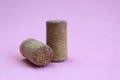 Wine cork two pieces on a pink background