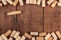 Wine corks and a corkscrew on a dark wooden background with a place for text Royalty Free Stock Photo