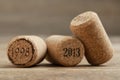 Wine corks with different dates on wooden table, closeup Royalty Free Stock Photo