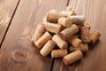 Wine corks heap over rustic wooden table background Royalty Free Stock Photo