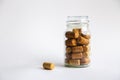 Wine corks lie in a glass jar on a white background Royalty Free Stock Photo