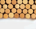 Wine corks on light paper background for your text. Yellow beige color of cork lying in row Royalty Free Stock Photo