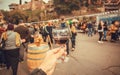 Wine drinkers on the annual city festival Tbilisoba, and crowd of people around. Georgia country.